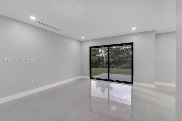 unfurnished room with recessed lighting, finished concrete floors, and baseboards