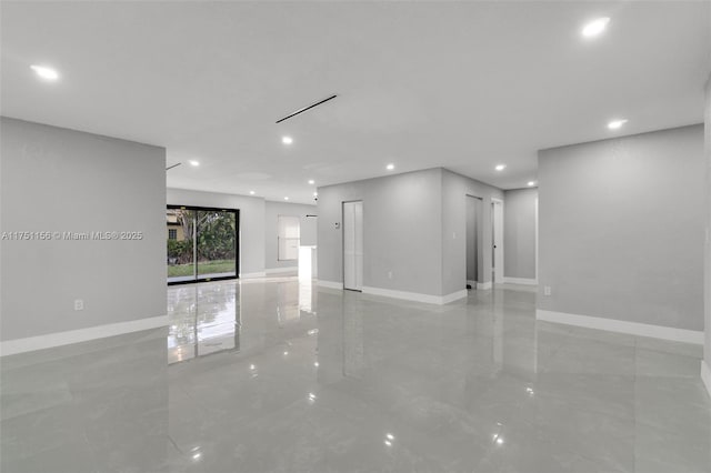 unfurnished living room with marble finish floor, recessed lighting, and baseboards