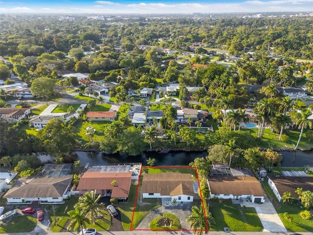 drone / aerial view with a water view and a residential view