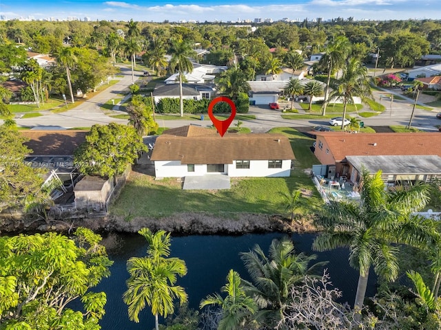 birds eye view of property with a water view