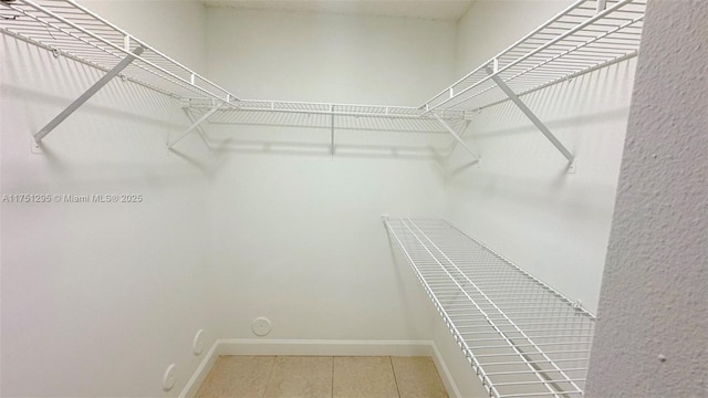 spacious closet with tile patterned flooring