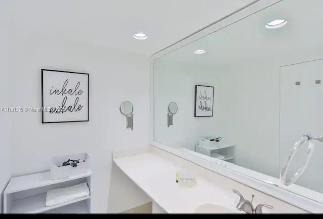 bathroom with vanity and recessed lighting