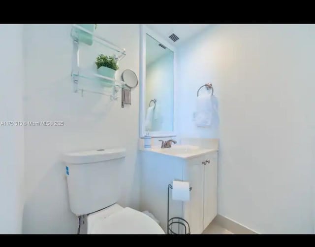 half bath with vanity and toilet