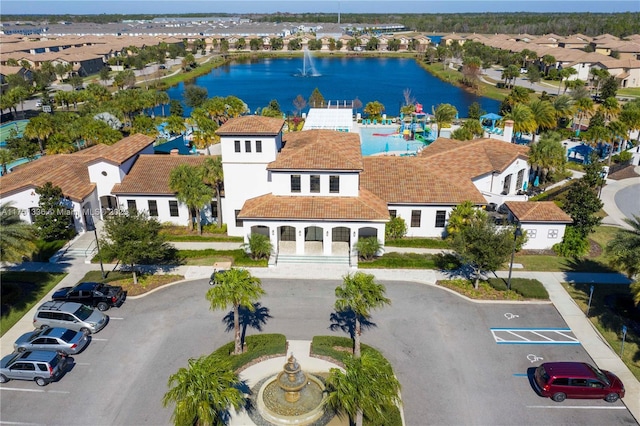 bird's eye view with a water view and a residential view