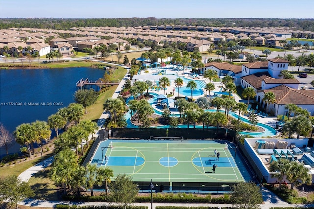 birds eye view of property with a residential view and a water view