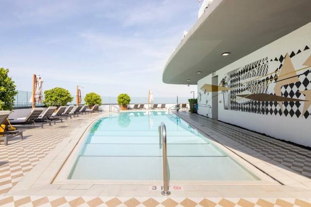 community pool featuring a patio area