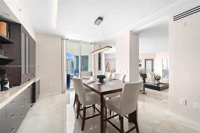 dining area with marble finish floor, visible vents, and baseboards