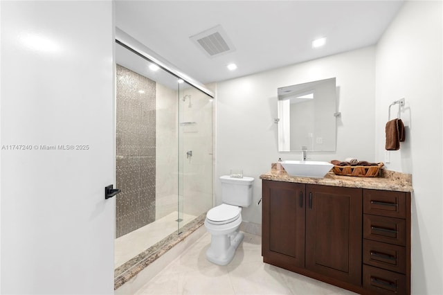 bathroom with toilet, a stall shower, visible vents, and vanity