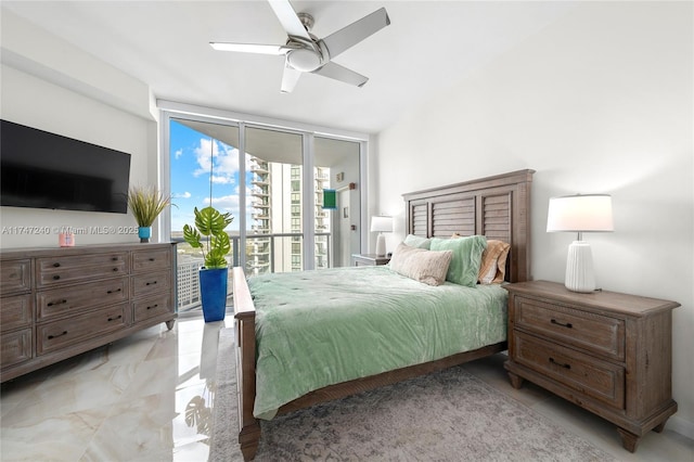 bedroom with expansive windows, ceiling fan, and access to exterior