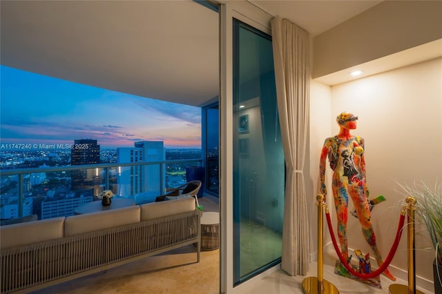 balcony featuring an outdoor living space and a city view