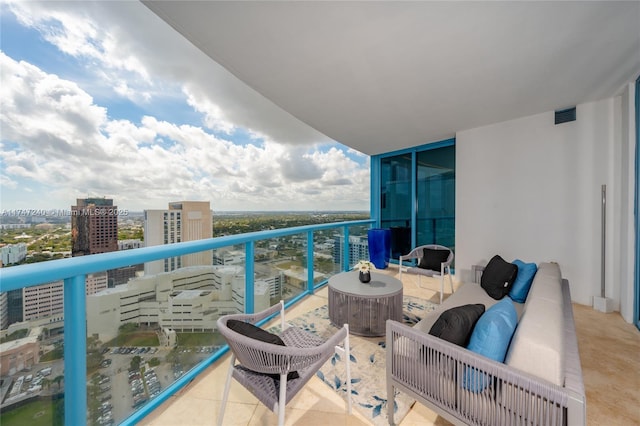 balcony featuring visible vents and a city view