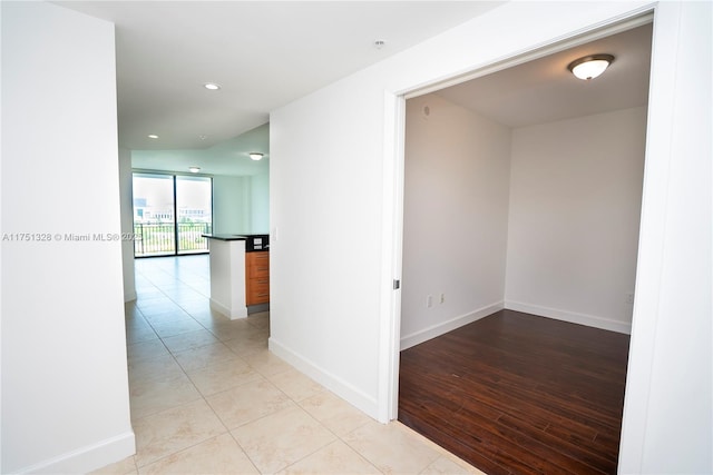 1300 Ponce De Leon Blvd Unit 709, Coral Gables, FL 33134 - hallway featuring light tile patterned floors, recessed lighting, and baseboards