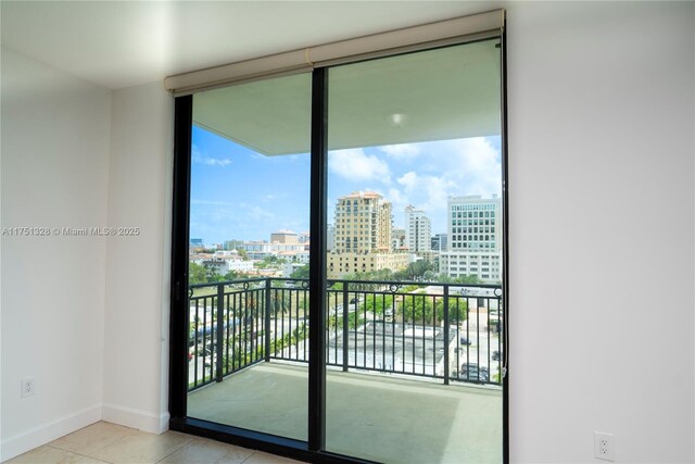 1300 Ponce De Leon Blvd Unit 709, Coral Gables, FL 33134 - interior space featuring a wealth of natural light, a city view, and baseboards