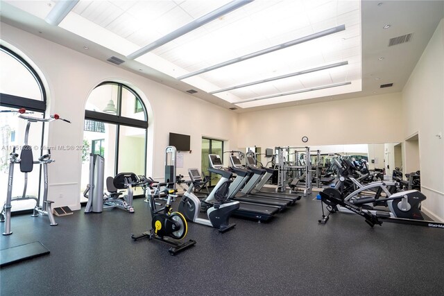 1300 Ponce De Leon Blvd Unit 709, Coral Gables, FL 33134 - exercise room with visible vents and a towering ceiling