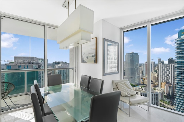 dining room with a view of city and expansive windows