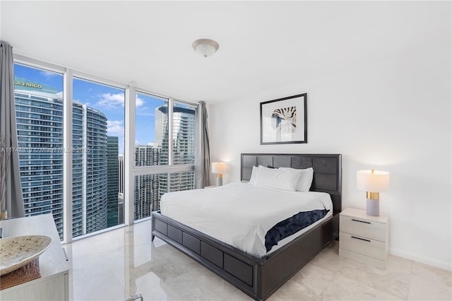 485 Brickell Ave Unit 4404, Miami, FL 33131 - bedroom with a view of city, baseboards, and floor to ceiling windows