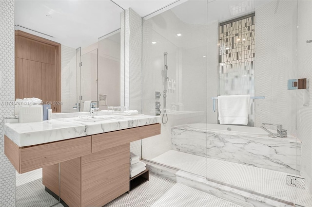 full bath with vanity, a garden tub, a marble finish shower, and tile patterned floors