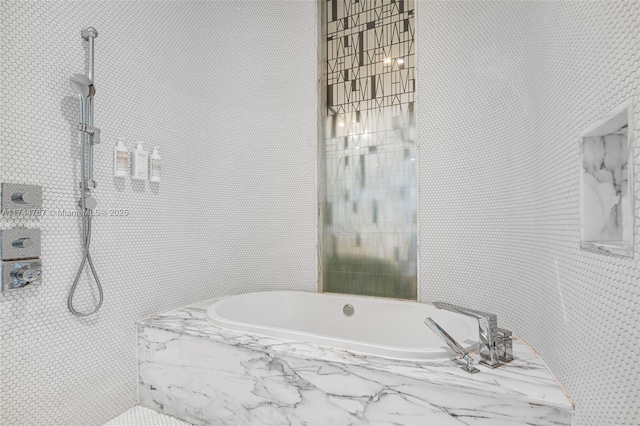 full bathroom with a garden tub and a marble finish shower