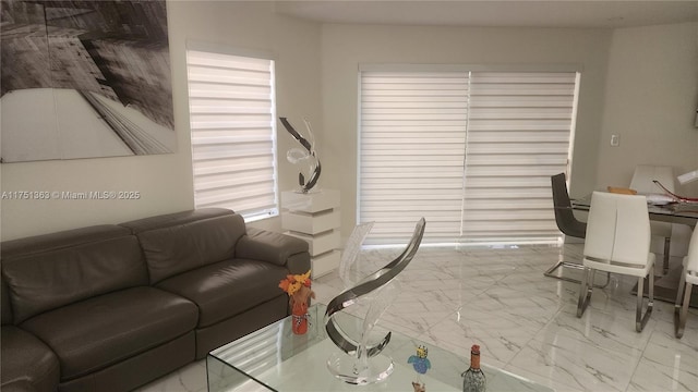 living area with marble finish floor