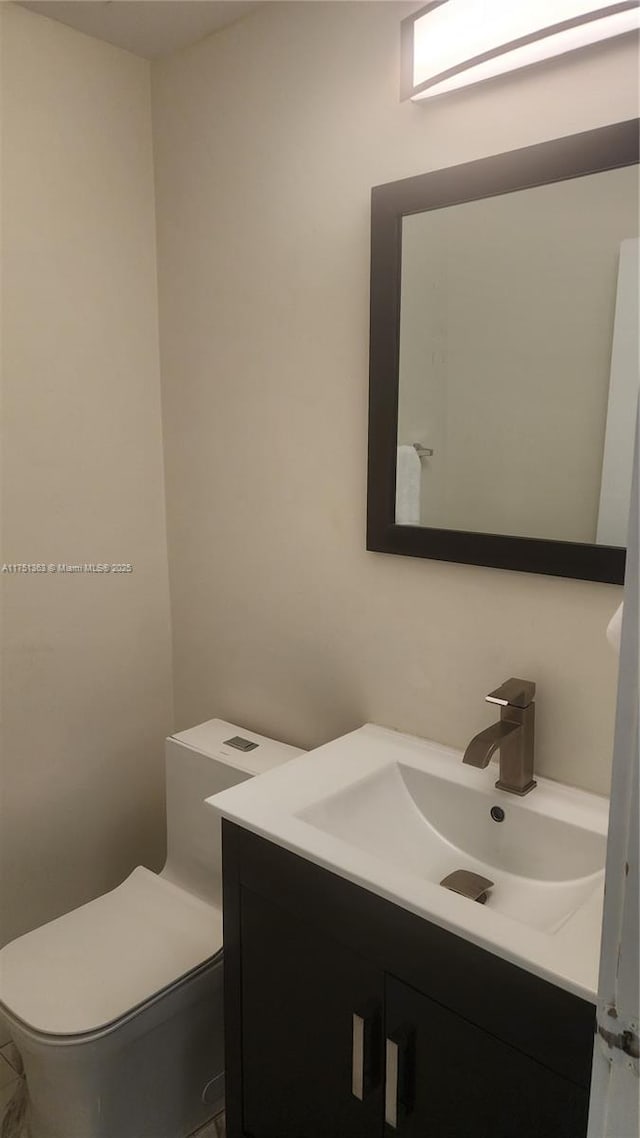 half bath with toilet and vanity