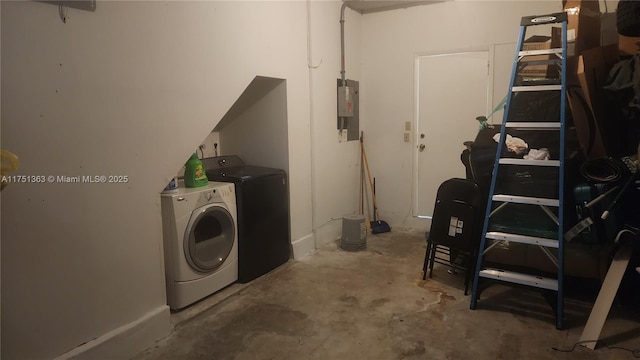 laundry room with laundry area, washer and clothes dryer, and electric panel