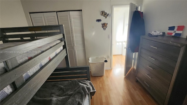 bedroom featuring a closet and wood finished floors