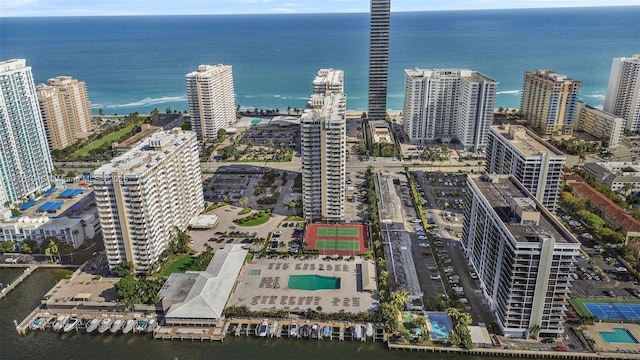 birds eye view of property featuring a water view and a view of city