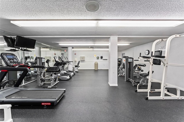 workout area with a textured ceiling