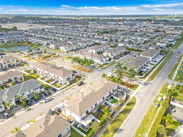 aerial view featuring a residential view and a water view