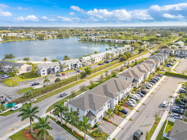 bird's eye view featuring a residential view and a water view