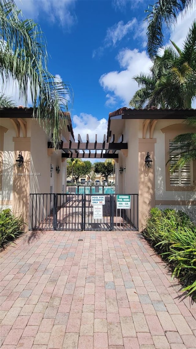 view of patio featuring a gate and fence