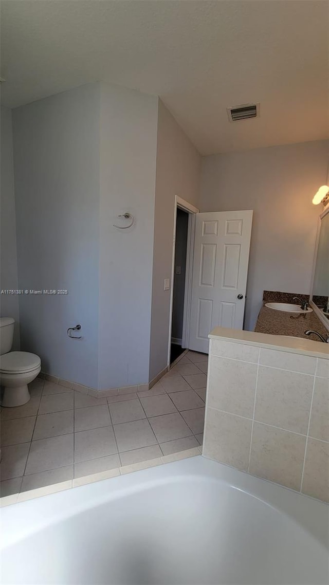 full bathroom featuring toilet, tile patterned flooring, visible vents, and vanity