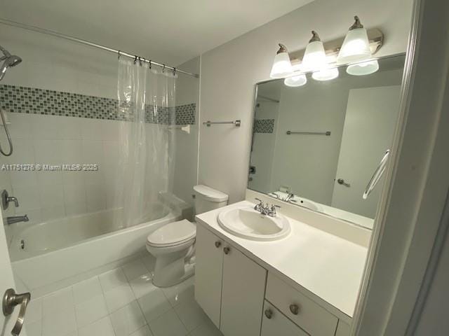 bathroom featuring toilet, shower / bath combo, tile patterned flooring, and vanity