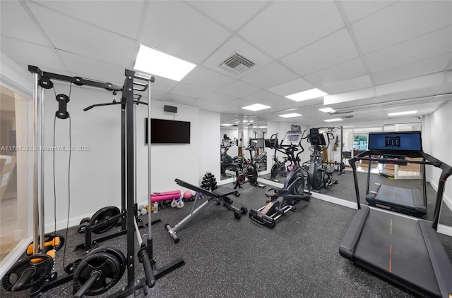 workout area with visible vents and a drop ceiling