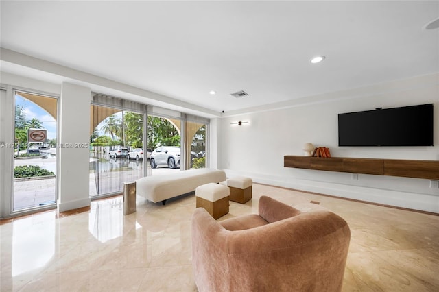 living room featuring recessed lighting, marble finish floor, visible vents, and baseboards