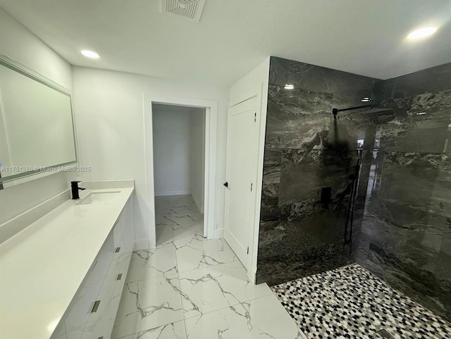 bathroom featuring recessed lighting, vanity, visible vents, marble finish floor, and a marble finish shower