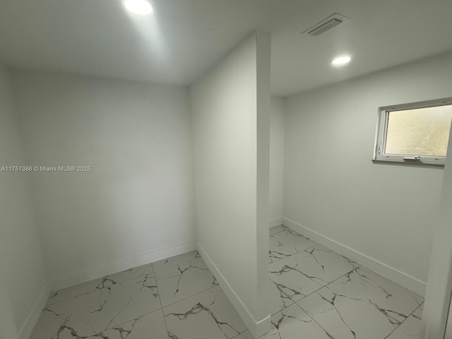 interior space with marble finish floor, baseboards, visible vents, and recessed lighting