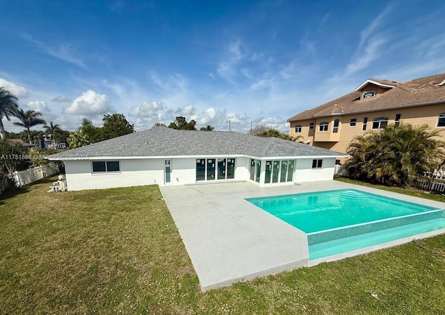 back of property featuring an outdoor pool, a lawn, a patio, fence, and stucco siding