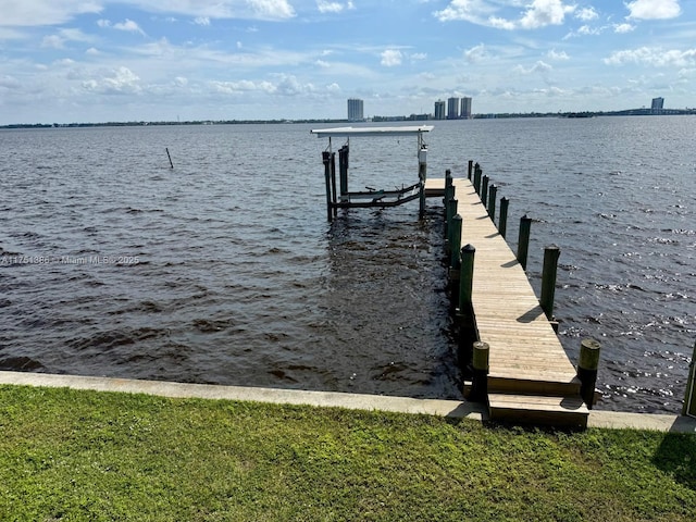 view of dock featuring a water view and boat lift