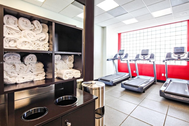 exercise room with a paneled ceiling