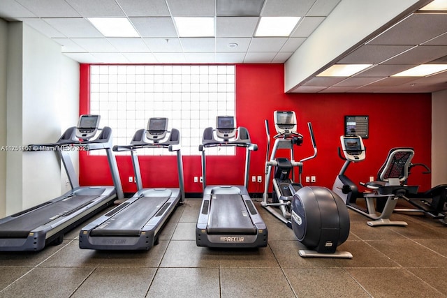 exercise room featuring a paneled ceiling