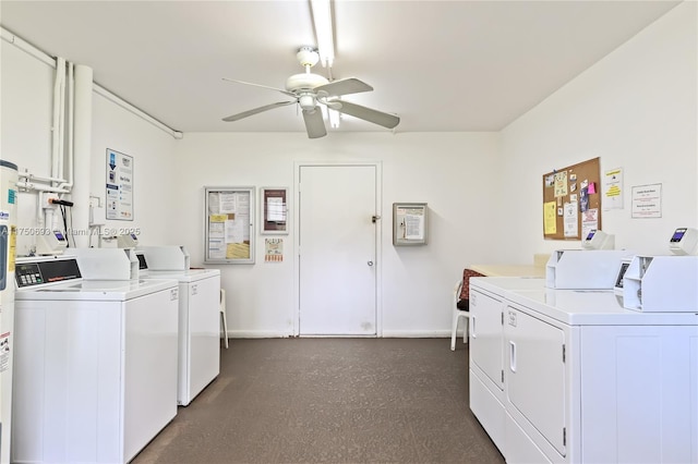 community laundry room featuring ceiling fan, baseboards, and separate washer and dryer