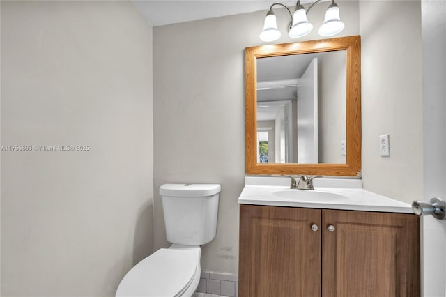 bathroom featuring toilet and vanity