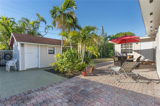 view of patio / terrace featuring outdoor dining area and an outdoor structure