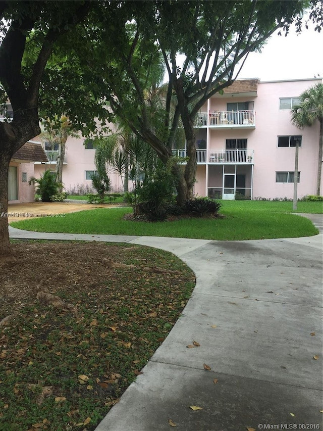 view of community featuring a yard