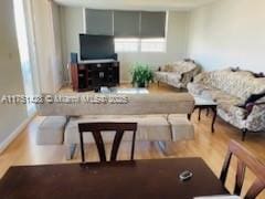 living area with wood finished floors