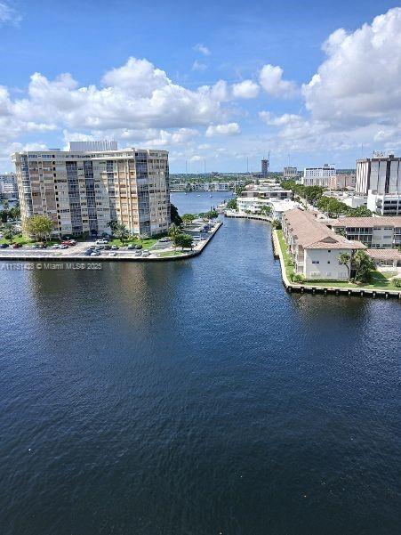 bird's eye view with a water view and a view of city