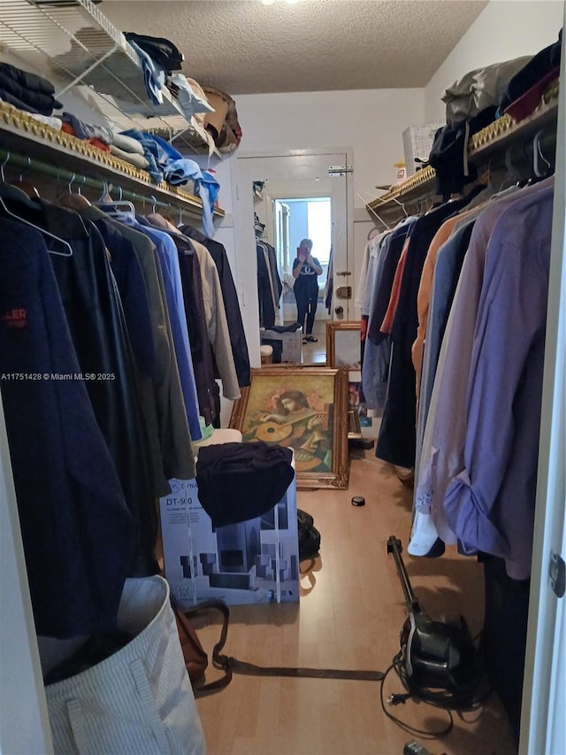 spacious closet with wood finished floors