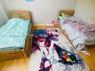 bedroom featuring wood finished floors