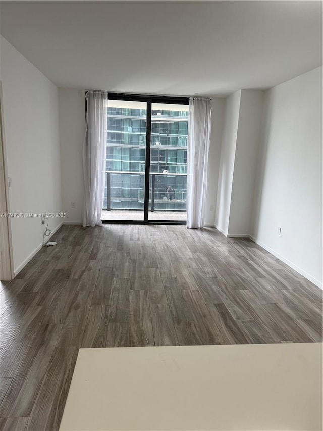 801 S Miami Ave Unit 1808, Miami, FL 33130 - spare room featuring wood finished floors and floor to ceiling windows